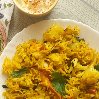 Let’s make this delicious and quick Pressure Cooker Veg Biryani that goes so well with raita / salad / papad for brunch or office / school lunchboxes too. Or a #potluck too ! 