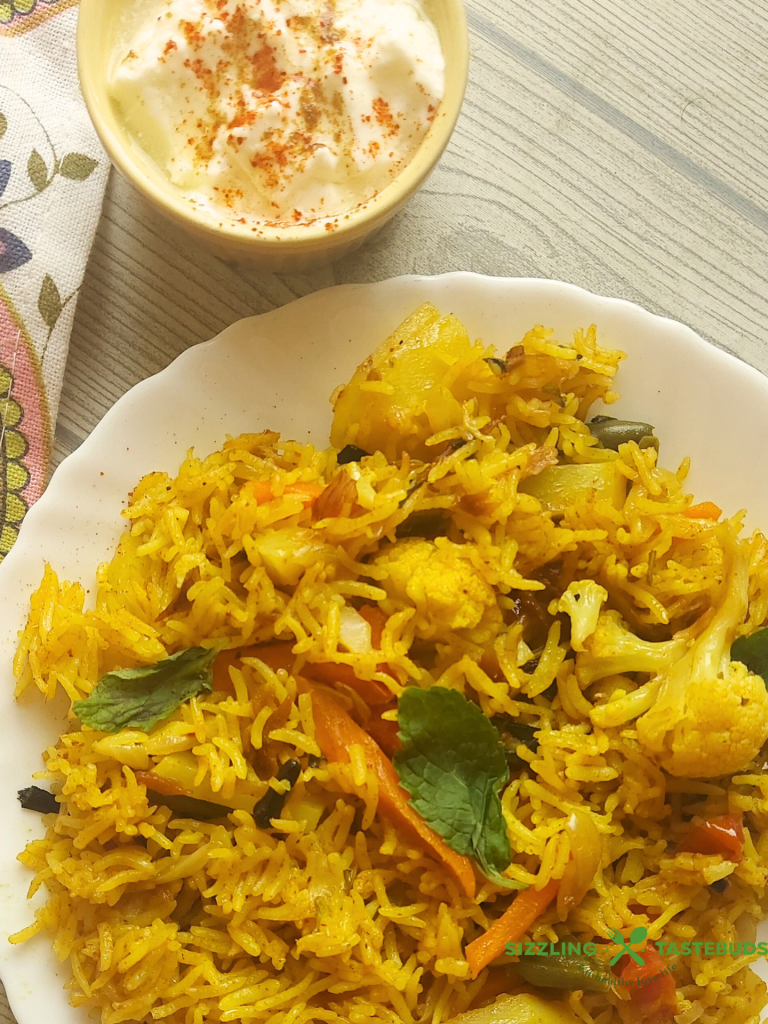 Let’s make this delicious and quick Pressure Cooker Veg Biryani that goes so well with raita / salad / papad for brunch or office / school lunchboxes too. Or a #potluck too ! 