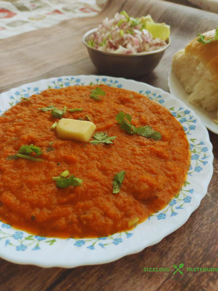 Instant pot Pav Bhaji is a quick, delicious take on the popular Indian Street food. Served with warm dinner rolls / pav and garnish for a sumptuous brunch, snack or dinner.