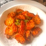 Garlic and Mint come together with carrots in this fuss free, Vegan + GF delicious dish that is made in minutes in an air fryer. Serve as a side or enjoy as a meal !