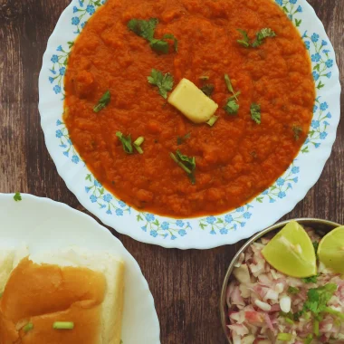 Instant pot Pav Bhaji is a quick, delicious take on the popular Indian Street food. Served with warm dinner rolls / pav and garnish for a sumptuous brunch, snack or dinner.